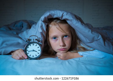 Cute Sleepless Little Girl In Bed Awake In The Middle Of The Night Looking Tired Having Troubles Staying Asleep At Night Or Waking Up Too Early In Insomnia Anxiety Sleeping Disorders In Children.