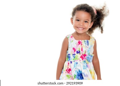 Cute Small African-american Or Hispanic Girl Wearing A Flowers Summer Dress Isolated On White