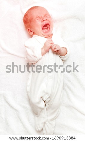 Similar – Image, Stock Photo Baby lies on a blanket and covers his eyes with his hands