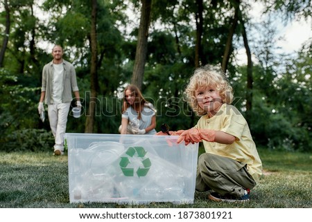 Similar – Image, Stock Photo Eco activist boy with banner “Wind Energy” on background of power stations for renewable electric energy production. Child and windmills. Wind turbines for generation electricity. Green energy