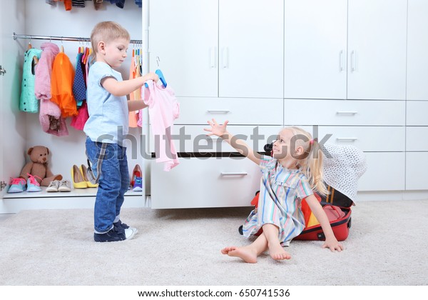 Cute Small Kids Playing Wardrobe Royalty Free Stock Image