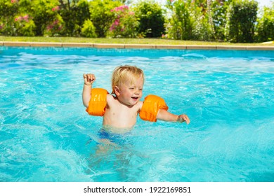 Cute Small Toddler Boy Walk In Inflatable Shoulder Straps In Swimming Pool