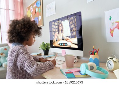 Cute smart african primary school kid girl distance learning by video conference call chat with remote teacher, online tutor teaching digital class, web lesson on computer at home. Virtual education.