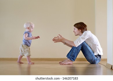 Cute Smiling Baby Girl Learning To Walk