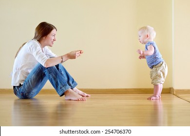 Cute Smiling Baby Girl Learning To Walk