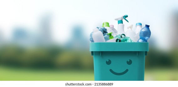 Cute smiling bin full of mixed plastic waste, recycling and separate waste collection concept - Shutterstock ID 2135886889