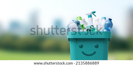 Cute smiling bin full of mixed plastic waste, recycling and separate waste collection concept