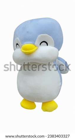 Cute smiling face penguin doll on isolated white background.