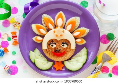 Cute Smiling Face  Of A Rio Carnival Dancer Made Of A Sandwich With Cheese And Fresh Vegetables Like Cucumbers And Carrots, Served With A Glass Of Milk. Healthy Lunch Or Snack For Kids