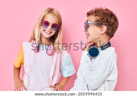 cute smiling kids wearing headphones posing Childhood lifestyle concept