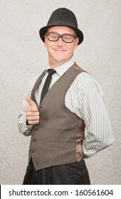 Cute smiling man giving thumbs up gesture