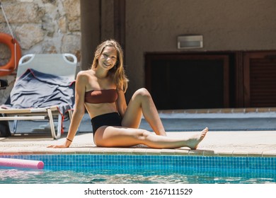 Cute Smiling Teen Girl Enjoying A Summer Vacation At The Swimming Pool.