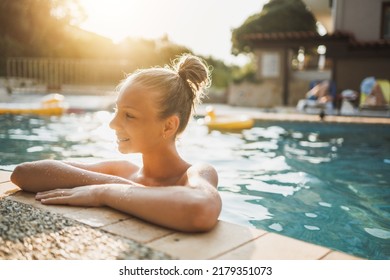 Cute Smiling Teen Girl Enjoying A Summer Vacation At The Swimming Pool.