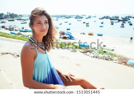 cute smiling young real woman in asian country sea port, vietnam traveller lifestyle