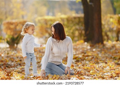 Cute And Stylish Family In A Autumn Park