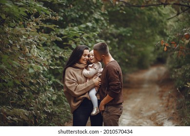 Cute And Stylish Family Playing In A Autumn Field