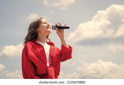 Cute And Stylish. Having A Party. Happy Kid With Microphone. Singing Songs In Karaoke. Lifestyle And People Concept. Make Your Voice Louder. Music And Life. Teen Girl Singing Song With Microphone