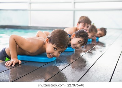 Cute swimming class at the pool at the leisure center