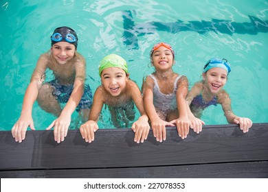 Cute swimming class in the pool at the leisure center - Powered by Shutterstock