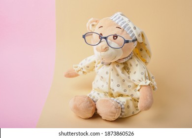 Cute Teddy Bear With Glasses On Beige And Pink Background, Color Trend, Copy Space, Baby Eye Glasses, Children Vision Test Concept