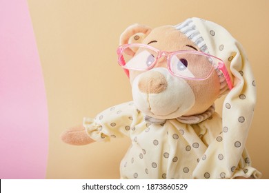 Cute Teddy Bear With Glasses On Beige And Pink Background, Color Trend, Copy Space, Baby Eye Glasses, Children Vision Test Concept