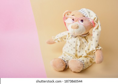 Cute Teddy Bear With Glasses On Beige And Pink Background, Color Trend, Copy Space, Baby Eye Glasses, Children Vision Test Concept