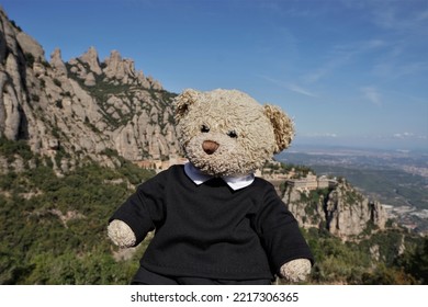 Cute Teddy Bear Sitting On The Mountain Of Montserrat In Monistrol De Montserrat, Catalonia, Spain.