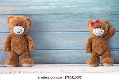 Cute teddy bears smiling behind the mask have a happy face for social distancing concept. with copy space.