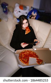 Cute Teen Cosplay Girl Gamer Eating And Playing Games At Night