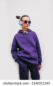 Cute Teen Girl In A Purple Hoodie. Kids Hoodies Mockup. Studio Shot On White Background.