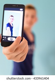 Cute Teenage Boy Taking Selfie