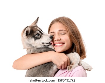 Cute Teenage Girl With Funny Husky Puppy On White Background