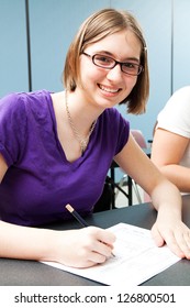 Cute Teenage Girl Taking A Standardized Test In High School.