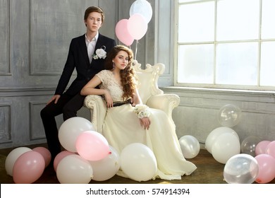 Cute Teenage Prom Couple in beautiful interior