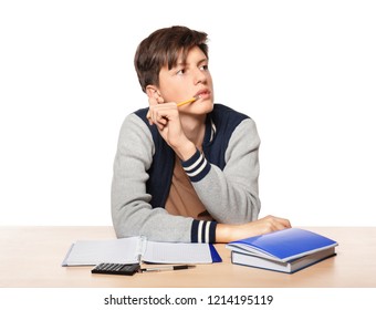 Cute Teenager Boy Doing Homework Against White Background