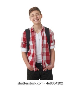 Cute Teenager Boy In Red Checkered Shirt With School Bag And Hands In Pockets Over White Isolated Background, Half Body, As School, Education Concept