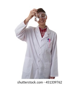 Cute teenager boy wearing white lab medic coat and protecting glasses with flask over white isolated background as science, experiment, healthcare concept