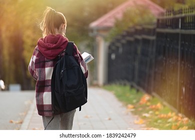 Cute teenager girl going to school with backpack. Students and education, young people at school                                - Shutterstock ID 1839242479