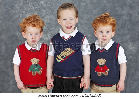 Cute three brothers Christmas portrait