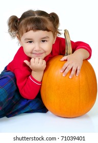 Cute Three Year Old Hispanic Girl With Pumpkin, Shot On White Background