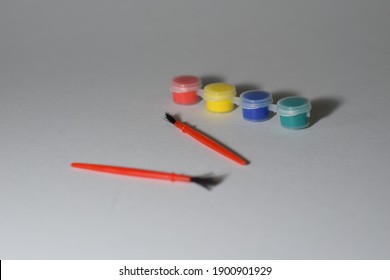 Cute Tiny Watercolour Brush and Paint Bottles with White Background 