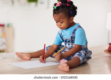 Cute Toddler Baby Girl Drawing With Pencils Using Both Hands