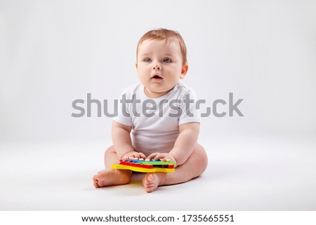 Image, Stock Photo Eight funny babies sitting on the floor