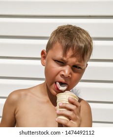 Cute Toddler Boy Eating Ice-Cream. Kid With Dirty Face Eating Ice Cream