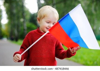 Cute Toddler Boy Holding Russian Flag Outdoors