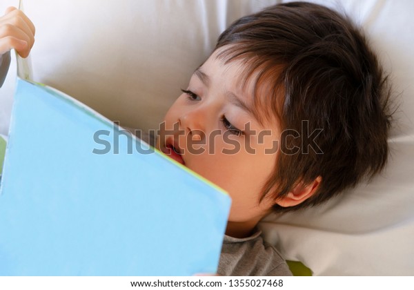 Cute Toddler Boy Laying Bed Readinga People Education