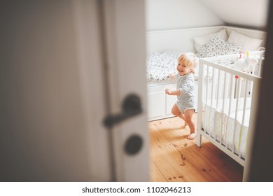 Cute Toddler Boy Running In A Bedroom.