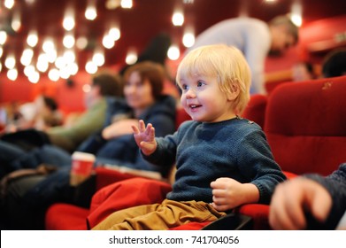 Cute toddler boy watching cartoon movie in the cinema. Leisure/entertainment for family with kids. - Shutterstock ID 741704056