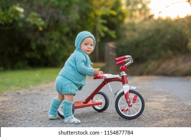 kid riding tricycle