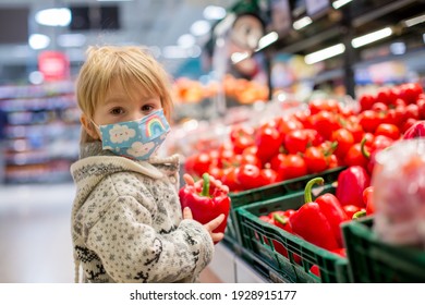 Cute Toddler Child, Boy, Wearing Medical Mask In Supermarket Store During Covid Pandemic Lockdown